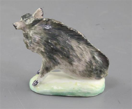 A rare Derby small figure of a seated wild boar, c.1760, h. 6.3cm, some restoration